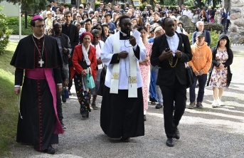 Priests and Catholics walking together