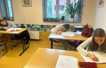 Children in Ukraine at their desks writing a test