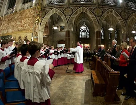 Priest and Choir boys performing at Christmas Carol Service