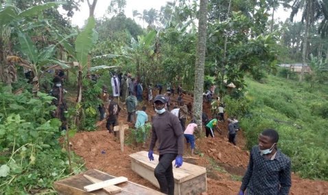 People burying victims in a forest area after ADF massacres in the DRC.